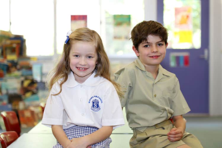 2 junior students enjoying the library