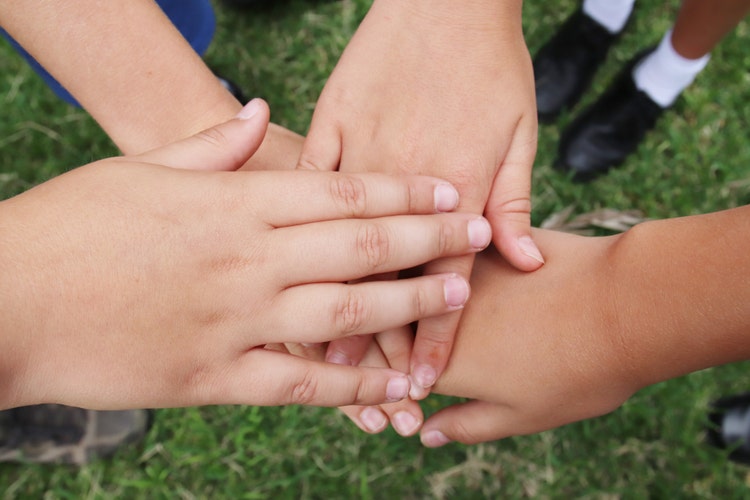 Students linking hands