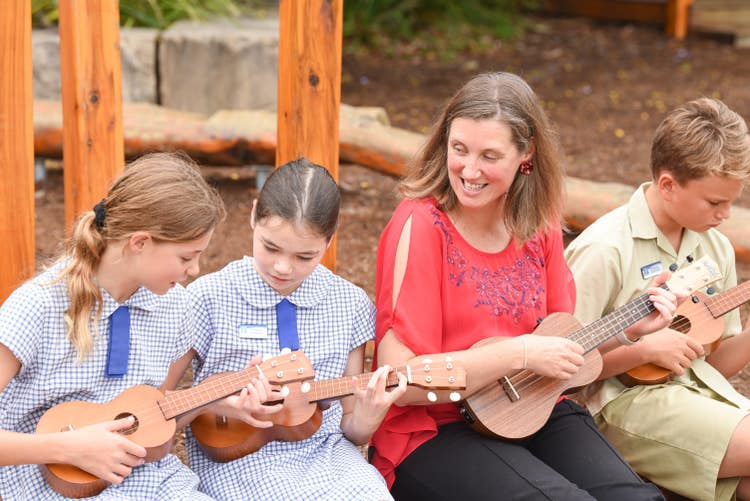 Our specialist music teacher teaching students ukelele