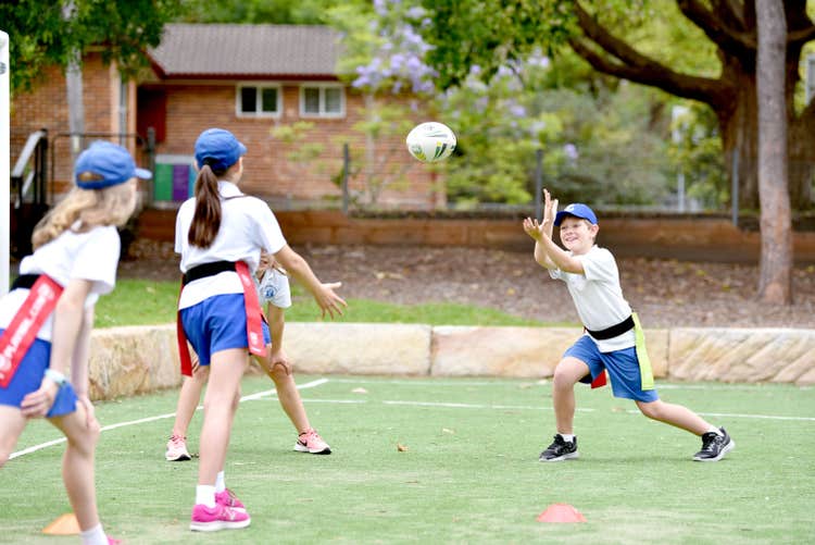 Students playing eagle tag on the Yatama Oval