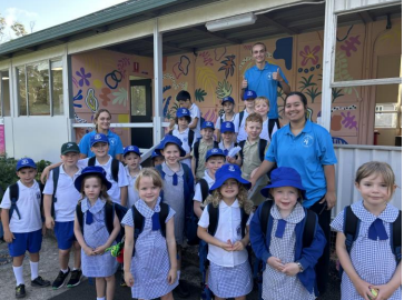 OSHC staff and attending students outside the SPS OSHC building